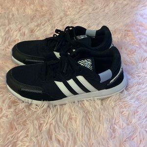 Black adidas with black and white animal print